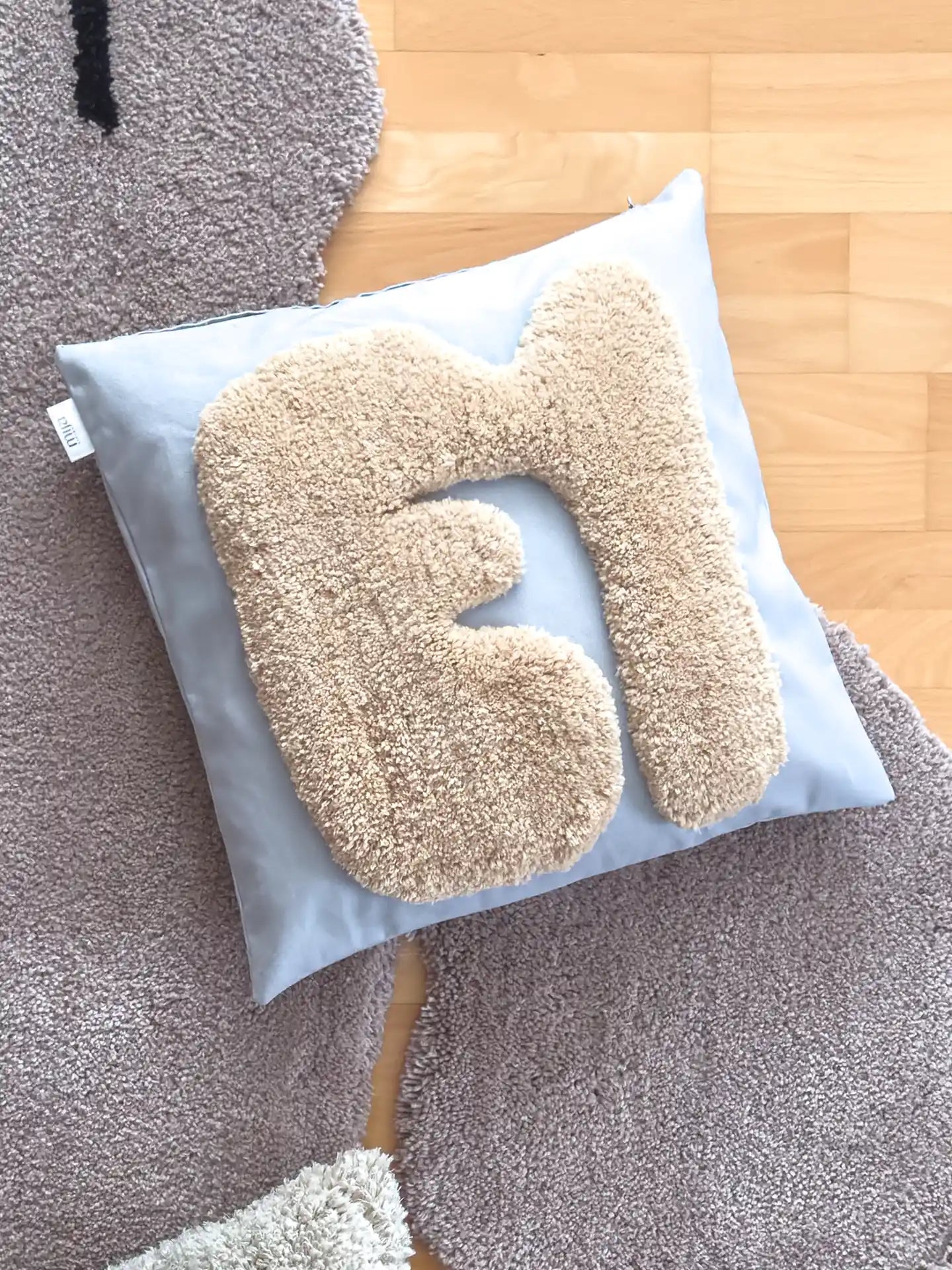 Kissen beige grau